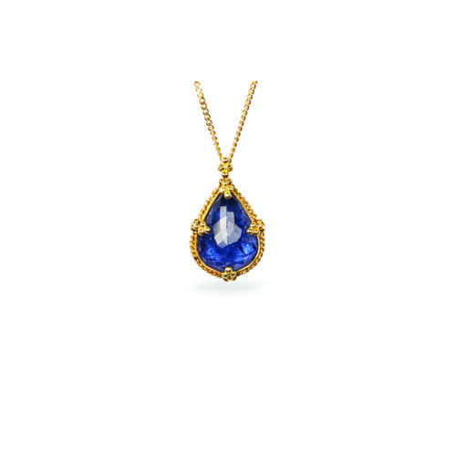 One-of-a-kind pendant with a tear drop-shaped Tanzanite,5.57cts, set in 18k yellow gold with granulation on bail. Pendant is 3/4" long x 1/2" wide (19mm x 12mm) on and adjustable 18k chain (16"-18").
