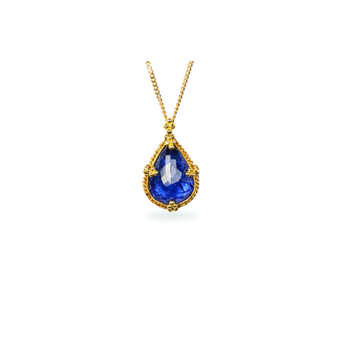 One-of-a-kind pendant with a tear drop-shaped Tanzanite,5.57cts, set in 18k yellow gold with granulation on bail. Pendant is 3/4" long x 1/2" wide (19mm x 12mm) on and adjustable 18k chain (16"-18").