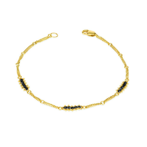 Textile station black diamond bracelet with approximately .70 cttw, in 18k yellow gold with a lobster clasp. Bracelet is 7" long x 3/16" wide (4 mm).