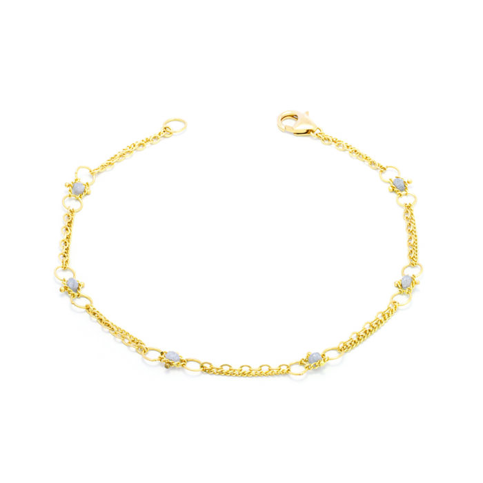 "Whisper Chain" silver diamond bracelet with approximately .60 cttw, in 18k yellow gold with a lobster clasp. Bracelet is 7" long x 3/16" wide (4mm).