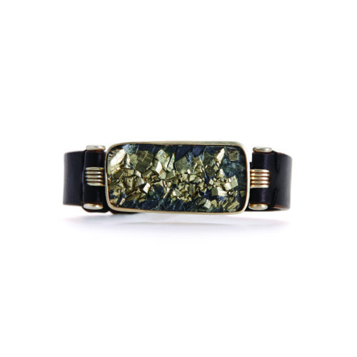 Pyrite in slate, set in 18k warm white gold, silver and steel in a leather band. Bracelet is 3/4" wide.