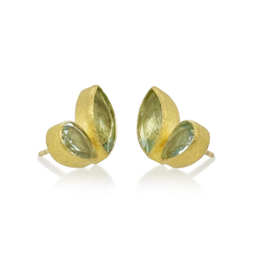 Faceted aquamarine stud-back earrings in mixed cuts and shapes, 4 cttw. Earrings are set in 22k gold bezels with 18k backings and spacers.
