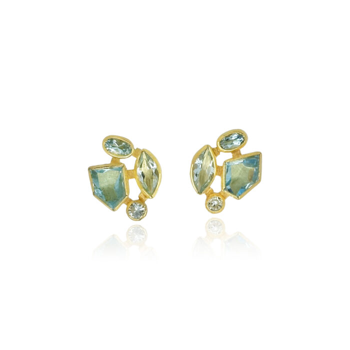 Faceted aquamarine stud-back earrings in mixed cuts and shapes, 4 cttw. Earrings are set in 22k gold bezels with 18k backings and spacers.