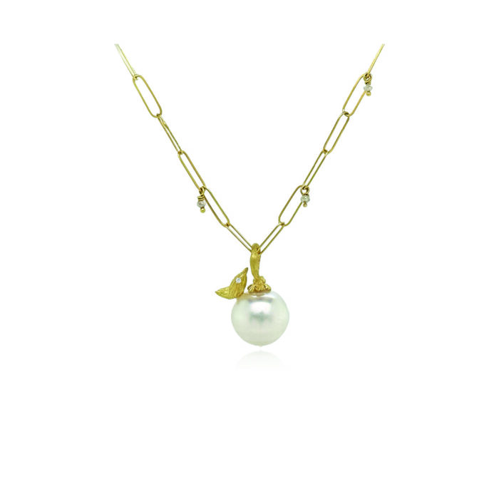 South Seas white pearl pendant in 18k yellow gold with hand-fabricated bird, white diamond, 0.01ct and flower bail. Pendant is 1" L x 1/2" diameter. ***CHAIN SOLD SEPARATELY***