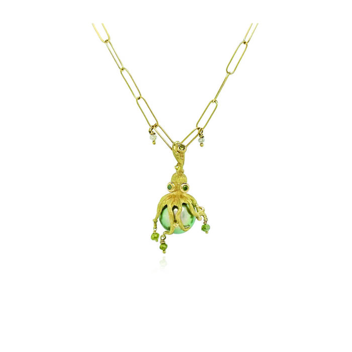 18k yellow gold, hand-fabricated octopus pendant with green diamonds, 0.09cttw and green diamond beads on a blue-grey Tahitian pearl. Pendant is 1 1/4" L x 5/8" diameter (32 x 16mm). ***CHAIN SOLD SEPARATELY***