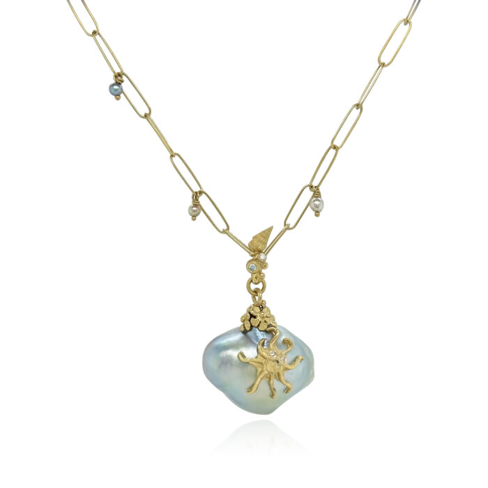 "Sea shore" pendant with a large blue Tahitian pearl, hand-fabricated 18k yellow gold octopus, seashell, flowers and bail with a blue diamond, 0.01ct, and white diamonds, 0.02cttw. Pendant is 1 5/8" long x 1" wide. ***CHAIN SOLD SEPARATELY***