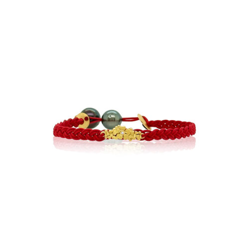 Braided red nylon bracelet with two Tahitian pearls and a gold bar of flowers with center diamond, 0.01 cttw. Bracelet is adjustable.