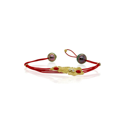 Red nylon bracelet with 18k yellow gold leaf (29mm long). Leaf is adorned with two round white diamonds, 0.04 cttw. Bracelet has two Tahitian pearls and is adjustable.
