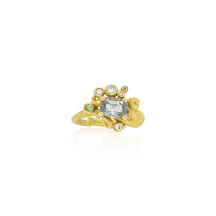 18k yellow gold band has a cluster of colored diamonds (0.10 cttw) and white diamonds (0.06 cttw) that surround a spinel in an East/West setting. Spinel is 1/2" wide (13mm) and ring is a size 6.75