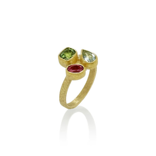 Cluster mixed shape faceted tourmalines in pink and green along with aquamarine set in 22k gold bezels with 18k backing on a 2.5mm ring shank. Ring is size 6.5+