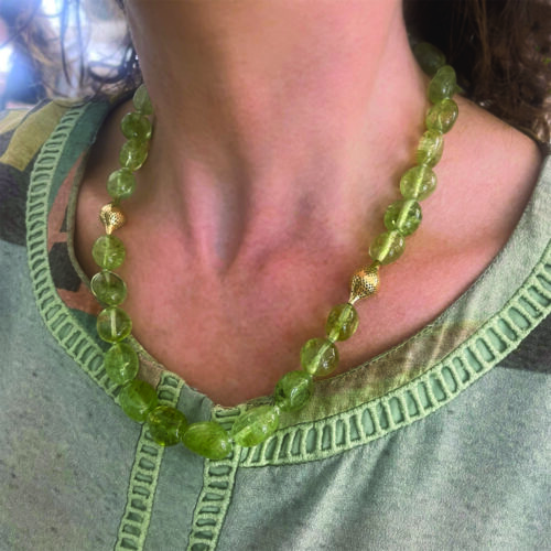 Tumbled round disc prasiolite beaded necklace with two small 18k yellow gold finials and small lilypad clasp. Necklace is 19.25" long and is 1/2" in diameter (13mm).
