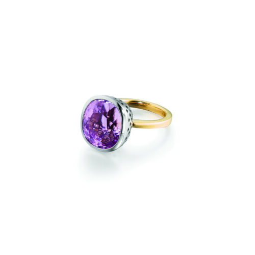 18k yellow gold cocktail ring with bezel set kunzite, 17.32 cts, in Palladium white gold crownwork setting. Ring is a size 7.5 and kunzite is 5/8"in diameter (16mm).