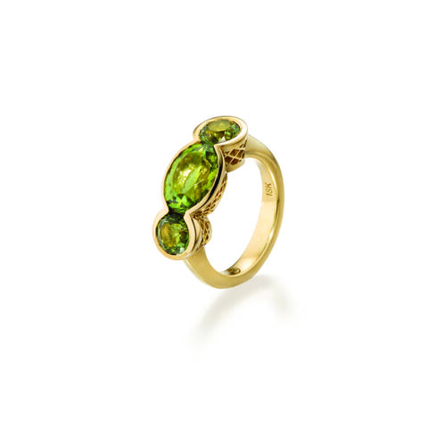 18k yellow gold crownwork, three-stone scallop ring with bezel-set green tourmaline center and side stones. Ring is a size 6.5 and stones are 3/8" wide (10mm).