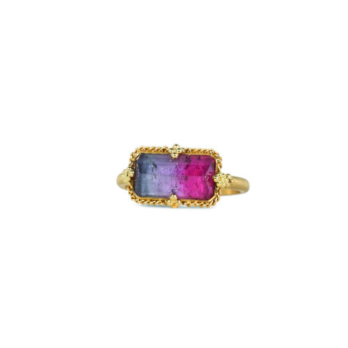 One-of-a-kind ring with a rectangular bi-color tourmaline in lavender and rubelite, in an East/West setting, 3.90 cttw. Tourmaline is 12 x 8mm set in an 18k gold bezel and band with granulated prongs and is a size 7.