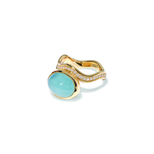 Aurora ring in 18k yellow gold with an oval aquamarine cabochon offset on a wavy pavé-set diamond band with vs white diamonds, 0.52 cttw. Ring is 5/8" wide (15mm) and is a size 7.