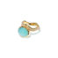 Aurora ring in 18k yellow gold with an oval aquamarine cabochon offset on a wavy pavé-set diamond band with vs white diamonds, 0.52 cttw. Ring is 5/8" wide (15mm) and is a size 7.