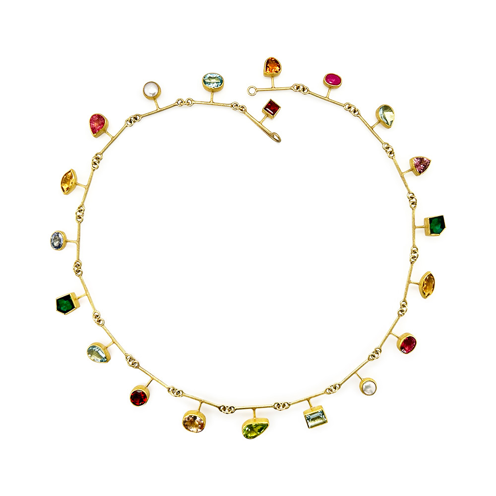 segment necklace with multi-colored gems