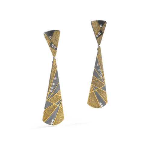 Necktie-shaped earrings in oxidized sterling silver with 18k and 22k yellow gold and white (G) diamond details, 0.18 cttw. Earrings are 2 9/16" long x 11/16" wide (6.5cm x 17mm) and are on posts.