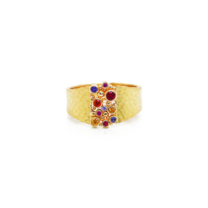18k yellow gold glacier ring with sapphires, 0.29 cttw, and two rubies. Ring is a size 7.5 and is 1/2" wide (12mm).