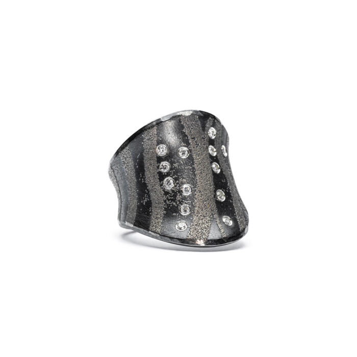 Oxidized sterling silver ring with platinum accents and white (G) diamonds, vsi, 0.13 cttw. Ring is 20mm (7/8") at its widest and is a size 5.75.