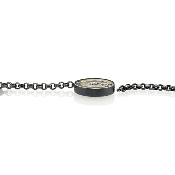 Round Vario clasp in oxidized sterling silver and 12k white gold, with white (G) diamonds, vsi, 0.18 cttw. Clasp is 27mm (1 1/8") diameter and 6mm high.