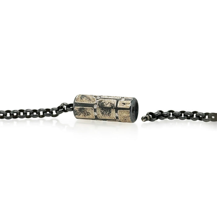 Vario spring style clasp with oxidized sterling silver, 12k yellow gold, and white (G) diamonds vsi, 0.23 cttw. Clasp is to be used with Vario style chains or strands, and is 1.1" long with a diameter of 0.4".