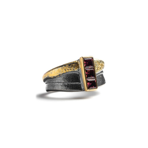 Pink sapphire ring, 0.62 cttw, in oxidized sterling silver, 22k yellow gold and 24k yellow gold, in a stacked vertical setting. Ring is a size 10.