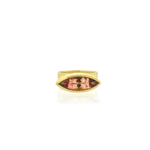 Faceted marquis shaped tourmaline in an East/West 22k gold bezel setting on an 18k yellow gold 7mm wide band. Ring is a size 6.25.