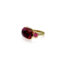 18k yellow gold crownwork, three-stone scallop ring with bezel-set pink tourmaline center stone, 8.35 cts, and pink sapphire side stones, 0.63 cttw. Ring is a size 6.5 and is 3/4" x 1/2".