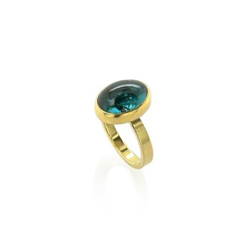 Cat's eye oval cabochon blue tourmaline, 6.67 cts, in 11k and 18k yellow gold. Ring is a size 6.75.