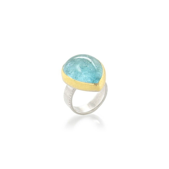 Tear-drop shaped cabochon aquamarine set in 22k yellow gold and a sterling silver ring shank. Aquamarine is 23 x 19mm and is a size 7.