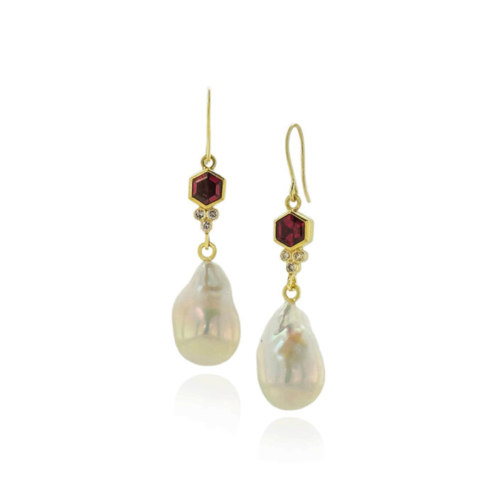 Hexagon-shaped rhodolite garnets with a diamond trillium accent set in 22k and 18k yellow gold with freshwater pearl drops on French wires.