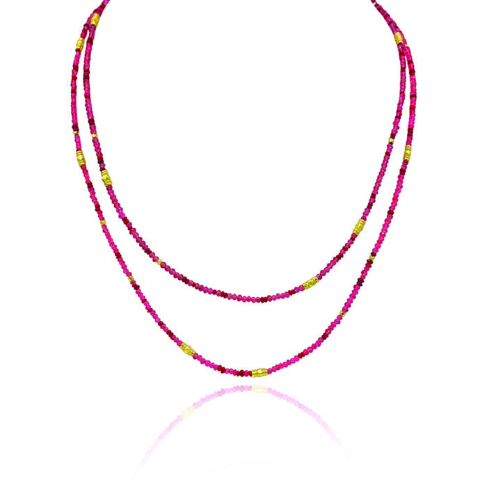 34" long multi-wrap ruby, 6.94 cttw, and red spinel, 25.48 cttw, beaded bracelet with gold beads. Bracelet has a lobster clasp and a 2" extension.
