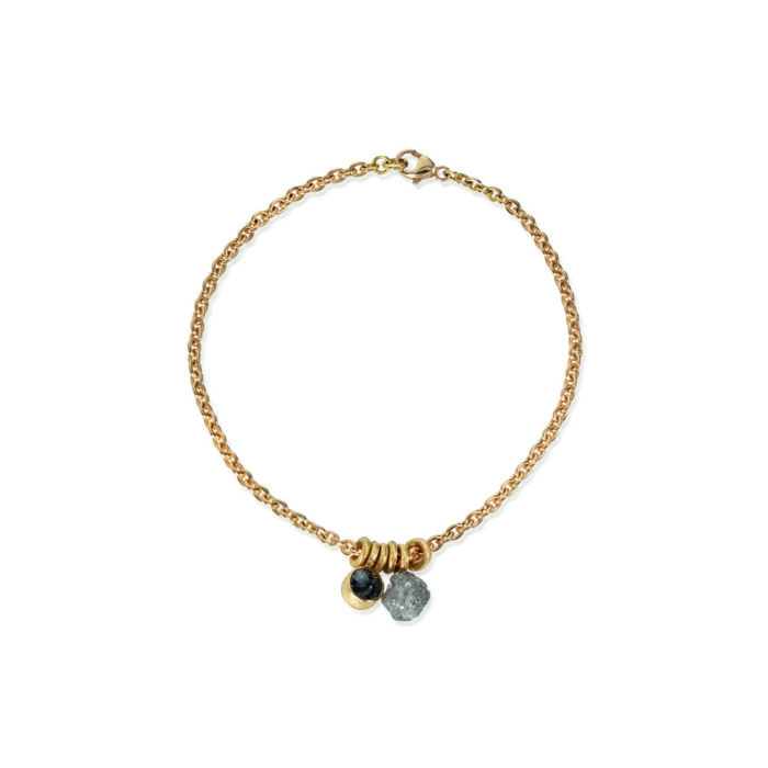 18k yellow gold bracelet with rough diamond sphere,5.2mm, 2.50cts, and rose-cut black diamond, 7mm, 1.31 cts, on a 18cm chain with a lobster clasp.