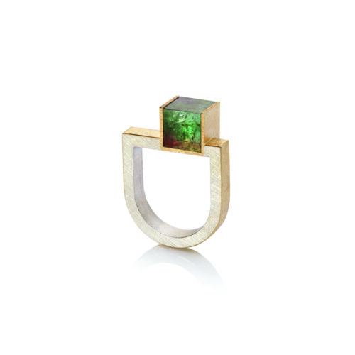 18k yellow gold and sterling silver U-shaped ring with an offset bi-color green and peach tourmaline cube, 8mm (predominately green). Ring is a size 8 and can be stacked with the offset bi-color pink tourmaline ring and U-shape diamond bar ring.