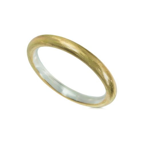 22k yellow gold and sterling silver wide hollow bangle, 10mm in diameter. Interior diameter of bangle is 8.5".