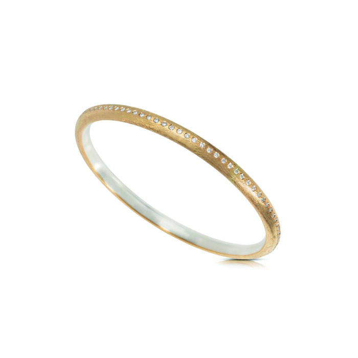 22k yellow gold and sterling silver round bangle with diamonds, 1.38cttw and 1.5mm diameter. Bangle is 4.5mm in diameter and has an inside diameter of 63mm.