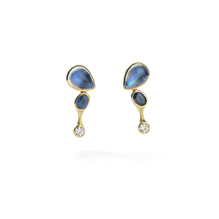 236.987 Earrings in 18K gold with blue flash moonstones, 5.67 cttw, unheated blue sapphires, 1.43 cttw, white (G) brilliant cut diamonds, 0.50 cttw, with post backs. Earrings are 1" L x 1/2" W (26 x 13mm).
