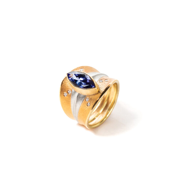 Navette Tanzanite ring in 18K & 22K gold, platinum, Tanzanite, 2.70 cts, vs white (G) diamonds, 0.04 ctts. Ring is size 8 and is 3/4" wide (20mm) at the widest point.