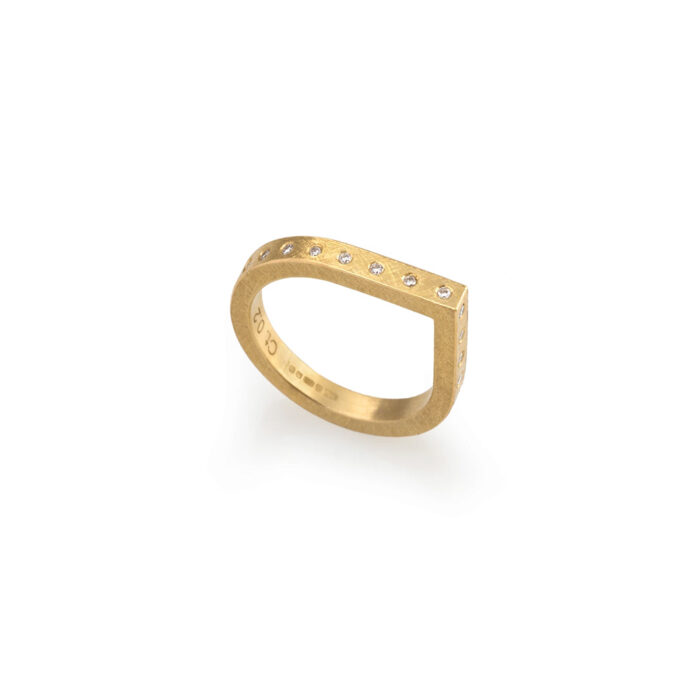 18k yellow gold tear drop-shaped ring with side-set diamonds, .22cttw. Ring is a size 7.