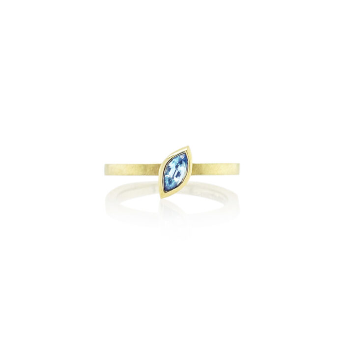 Marquise-shaped blue zircon ring, 6 x 3 mm, set in 14k yellow gold. Ring is a size 6.