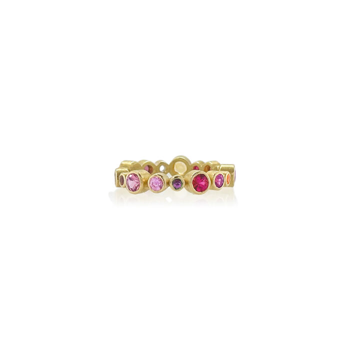 18k yellow gold ring with multi-color (pink and purple) sapphires, 1.75 cttw, and rubies, 0.06 cttw. Sapphires range in size from 1.9-3.75 mm and ring is a size 6.5.
