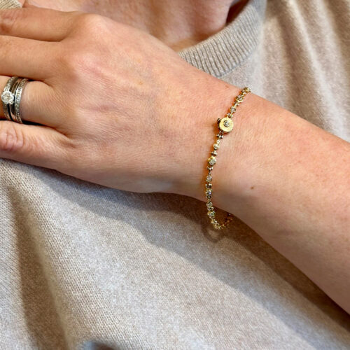 Candlelight bracelet with hinged diamonds