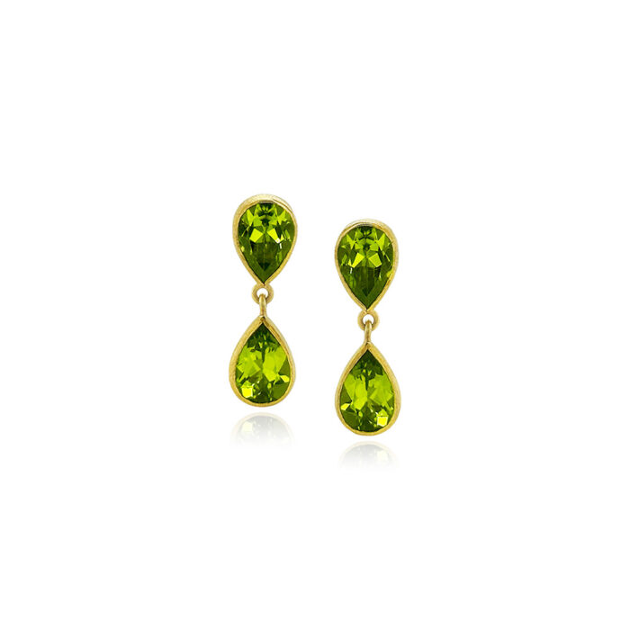 Faceted peridot double drop earrings, set in 22k yellow gold bezels with 18k yellow gold backings, seperated by jump rings, on posts. Earrings are 1" long x 5/16" wide (25 x 8 mm).