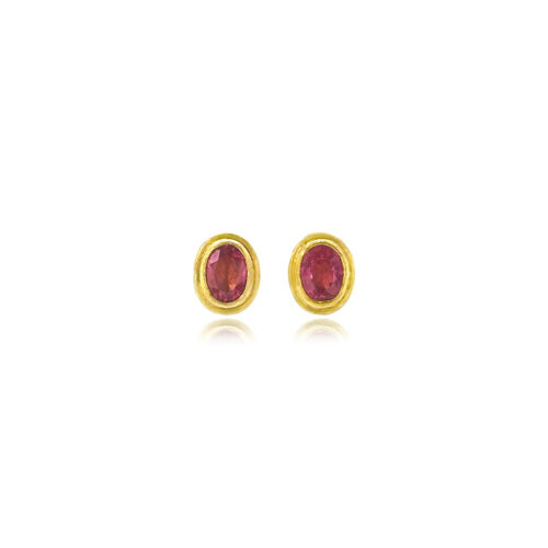 Faceted pink tourmaline oval studs set in 22k yellow gold bezels with 18k yellow gold backings and frames, on posts. Earrings are 5/8" long x 5/16" wide (10 x 7 mm).