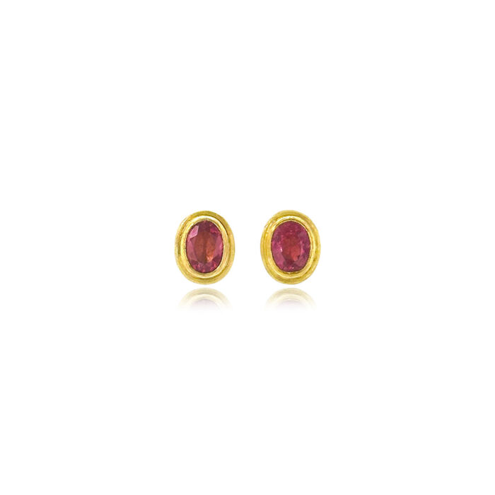 Faceted pink tourmaline oval studs set in 22k yellow gold bezels with 18k yellow gold backings and frames, on posts. Earrings are 5/8" long x 5/16" wide (10 x 7 mm).