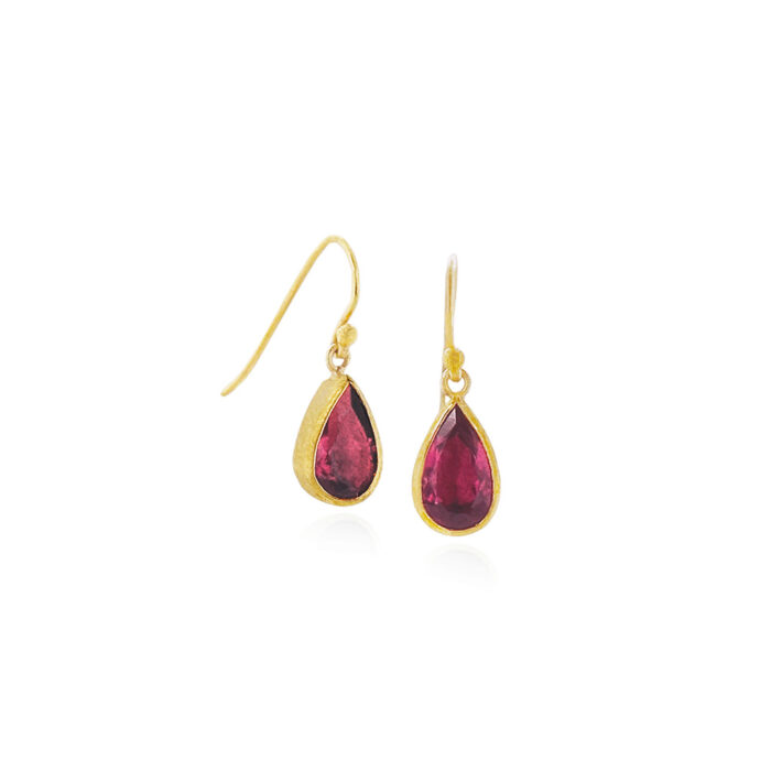 Faceted teardrop red tourmalines, 3.60 cttw, set in 22k yellow gold bezels and 18k yellow gold backings, on French wires. Earrings are 7/8" long x 9/32" wide (22 x 7 mm).
