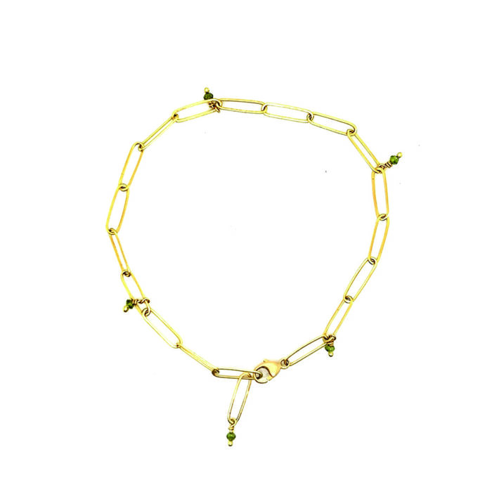 Adjustable popsicle bracelet in 18k yellow gold with green diamond beads and a lobster clasp.