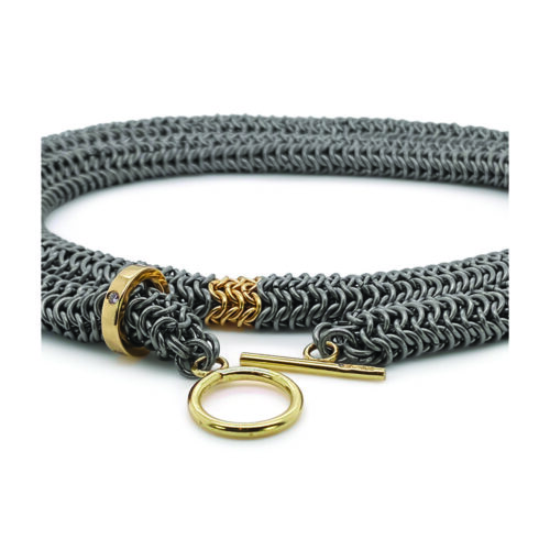 Wrap around bracelet in titanium, with 18k yellow gold accent and an 18k yellow gold and diamond runner. Bracelet is 25" long and 3/8" wide (10mm).