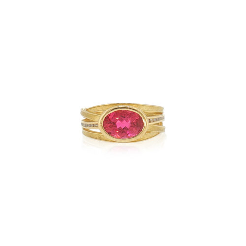 two-tiered oval pink tourmaline ring with 4 blades and channel set diamonds in the central blades